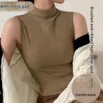 High-neck vest with chest pads. Style and comfort in one piece.