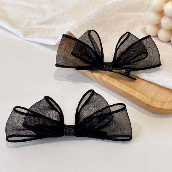 meticulously designed black mesh hairpin features a delicate, sheer design that gives you a feminine look that balances simplicity and elegance.