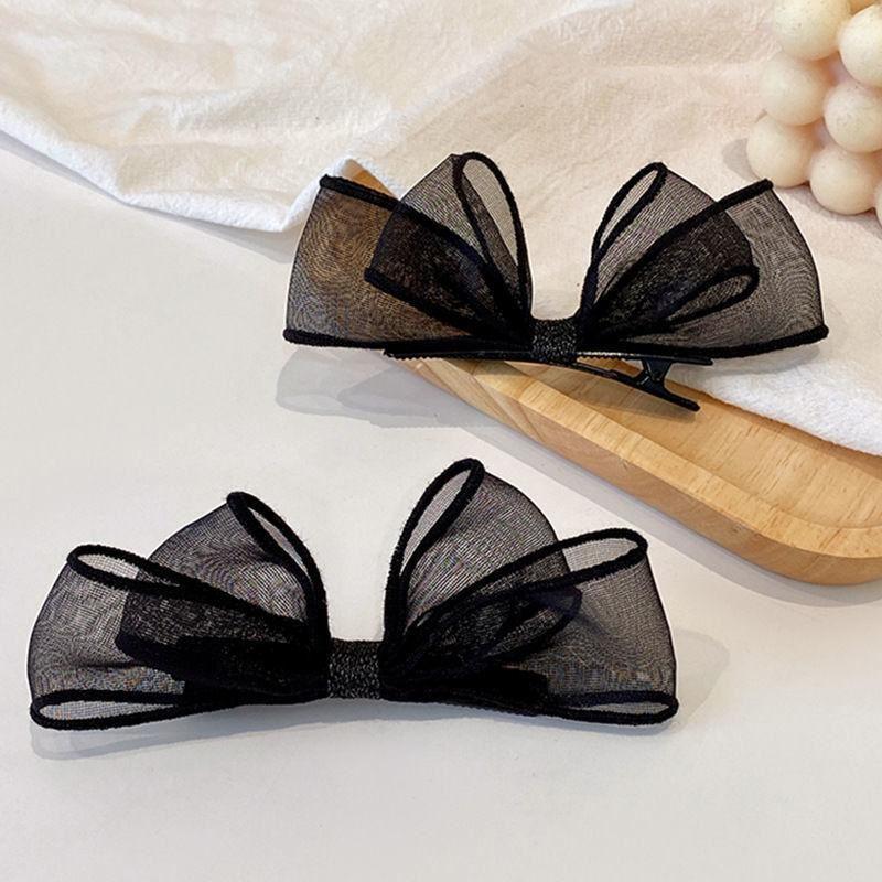 meticulously designed black mesh hairpin features a delicate, sheer design that gives you a feminine look that balances simplicity and elegance.