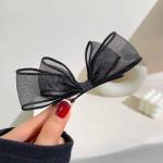meticulously designed black mesh hairpin features a delicate, sheer design that gives you a feminine look that balances simplicity and elegance.