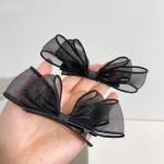 meticulously designed black mesh hairpin features a delicate, sheer design that gives you a feminine look that balances simplicity and elegance.