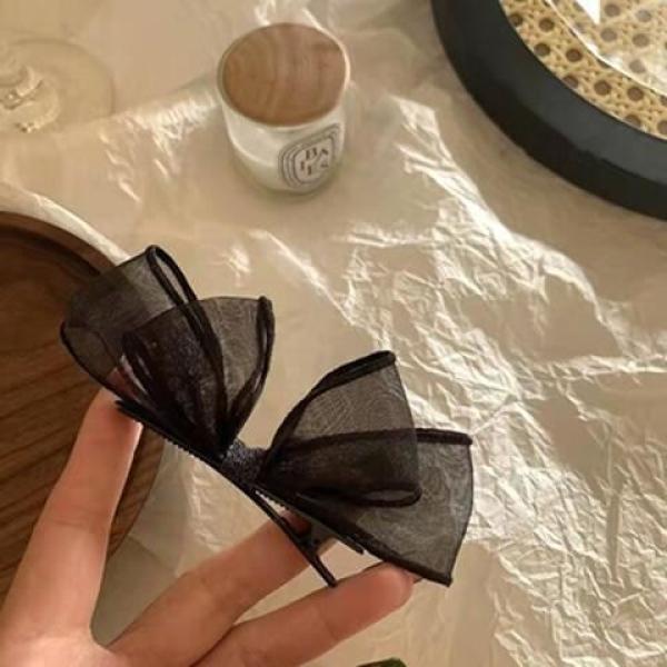 meticulously designed black mesh hairpin features a delicate, sheer design that gives you a feminine look that balances simplicity and elegance.