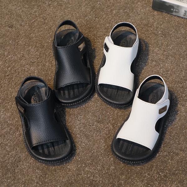 A pair of sandals for girls and boys, knitted and made of high-quality materials.