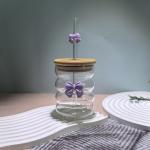 Elegant glass cup with lid and straw