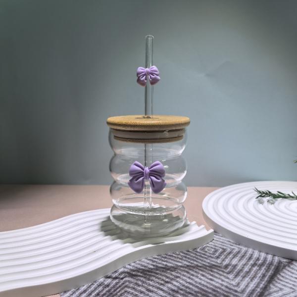 Elegant glass cup with lid and straw