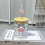 Elegant glass cup with lid and straw