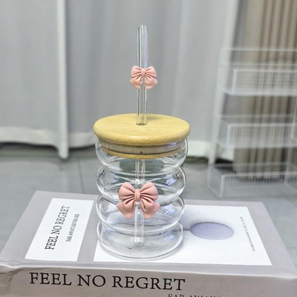 Elegant glass cup with lid and straw