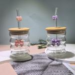 Elegant glass cup with lid and straw