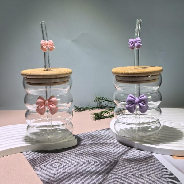 Elegant glass cup with lid and straw