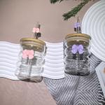 Elegant glass cup with lid and straw