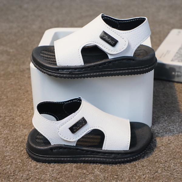 A pair of sandals for girls and boys, knitted and made of high-quality materials.