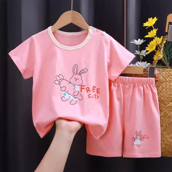 A set of short-sleeved T-shirt and matching shorts, featuring a range of attractive designs that reflect the spirit of childhood and add a touch of joy to your little one's look.