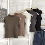 High-neck vest with chest pads. Style and comfort in one piece.