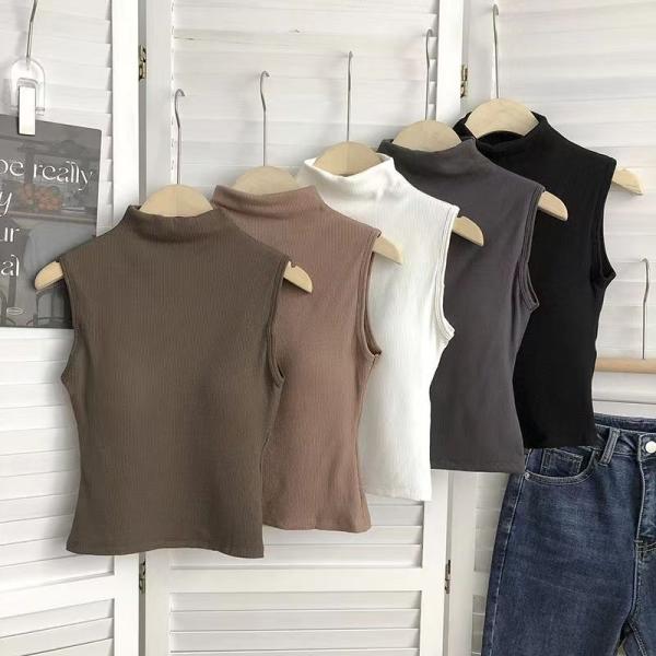 High-neck vest with chest pads. Style and comfort in one piece.