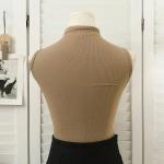 High-neck vest with chest pads. Style and comfort in one piece.