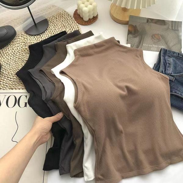 High-neck vest with chest pads. Style and comfort in one piece.