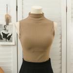 High-neck vest with chest pads. Style and comfort in one piece.