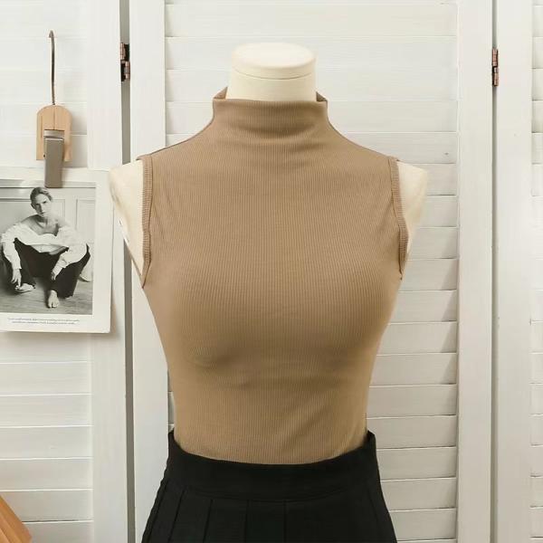 High-neck vest with chest pads. Style and comfort in one piece.